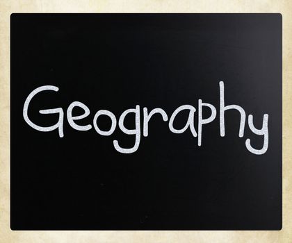 "Geography" handwritten with white chalk on a blackboard