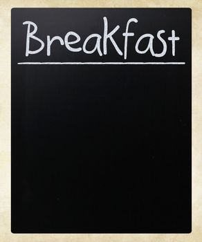 "Breakfast" handwritten with white chalk on a blackboard