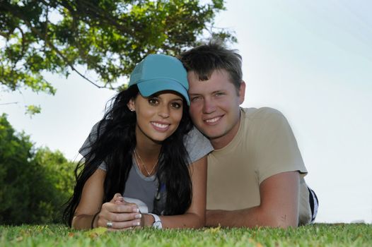 Young man and woman relaxing outside