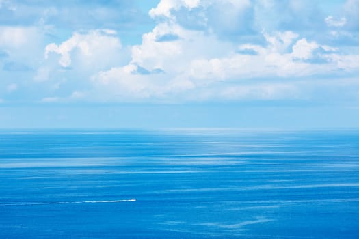 Speeding boat in blue sea. Andaman Sea, Thailand