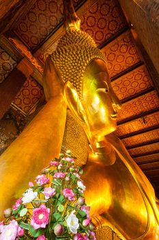 Reclining Buddha face. Wat Pho, Bangkok, Thailand