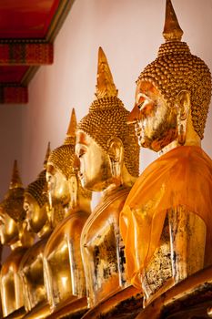 Sitting Buddha statues close up. Wat Pho temple, Bangkok, Thailand