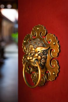 Doorknob of the Temple shaped as a jiaotu (dragon). Shuang Lin Temple, Singapore