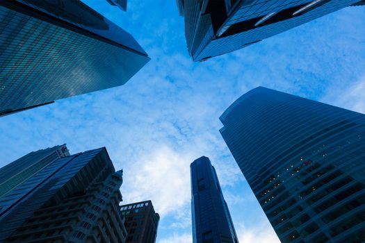 Urban buildings skyscrapers in sky on dusk background