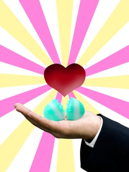 Easter egg with red heart on businessman hand