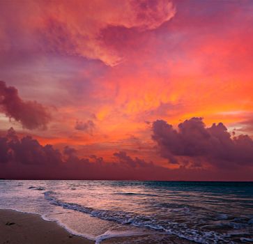 Calm peaceful ocean and beach on tropical sunrise. Bali, Indonesia