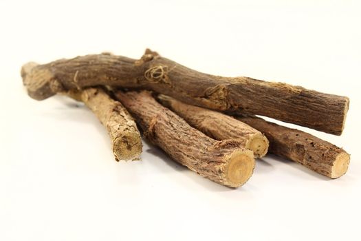 some pieces of licorice on a white background