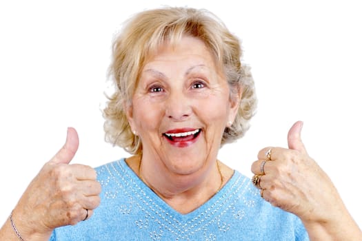 Happy senior woman giving two thumbs up as sign of approval.