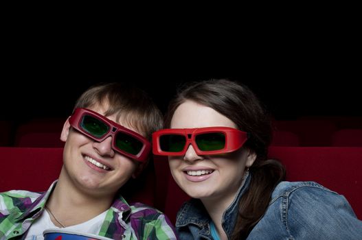 couple in a movie theater, watching a 3D movie