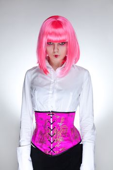 Attractive woman dressed in oriental corset, studio shot over white background 