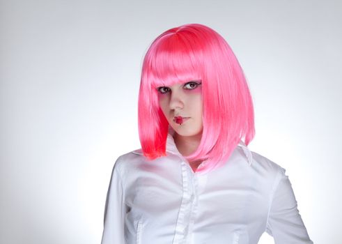 Attractive woman with pink hair and Japanese make-up, studio shot  