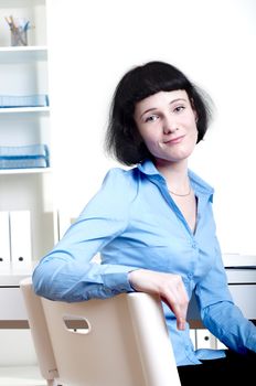 Portrait of a business woman in the office doing some paperwork