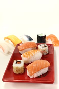 fresh Japanese sushi with salmon, shrimp, carrots and cucumber