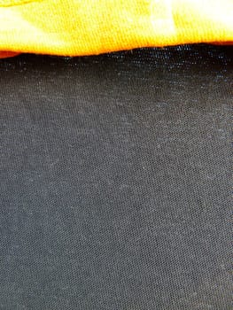 yellow edge on some black fabric