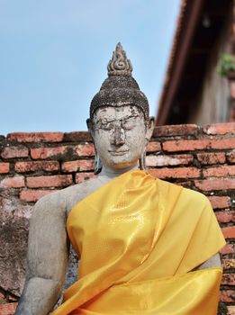 Stone statue of a Buddha in Ayutthaya, Thailand. 