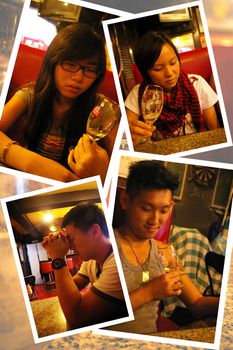 Asian people drinking wine in bar