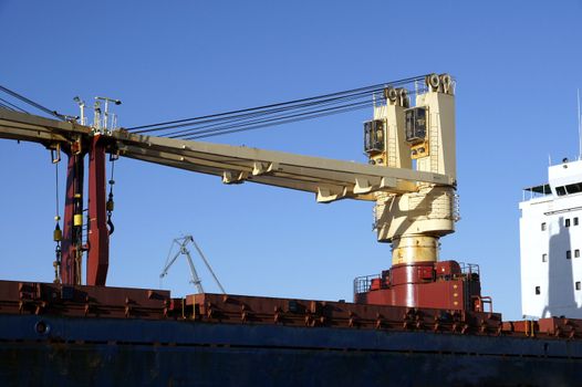 Ship cranes on a deck of the cargoship