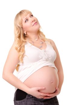 Pregnant woman caressing her belly and looking up isolated on white