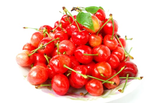 Fresh red ripe cherry fruits on a white background