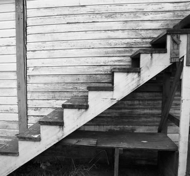 Black and white image of a worn and weathered staircase