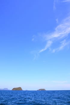 Small island with sunny and blue sky in summer