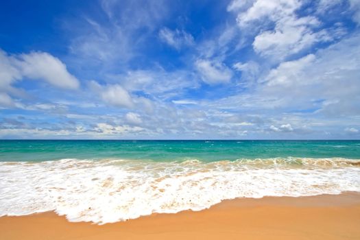 Ripple on White Sand Beach with Perfect Sunny Sky at Phuket Thailand