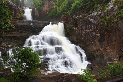 tropical rainforest waterfall in jungle of Thailand landscpae
