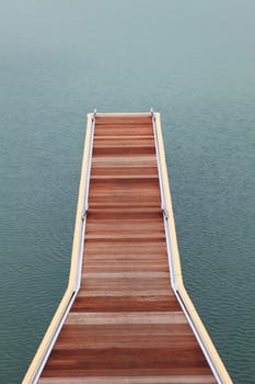 wooden jetty walkway and pathway pier of marina on sea