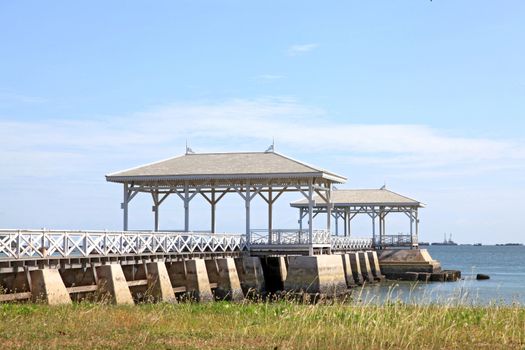 wooden jetty walkway with royal pavillion to the sea at Srichang Island Thailand with blue sky