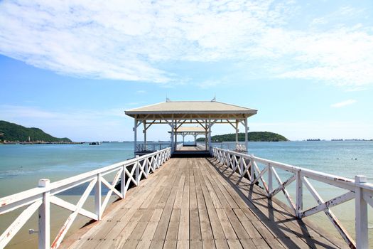 wooden jetty walkway with pavillion to the sea at Srichang Island Thailand with blue sky
