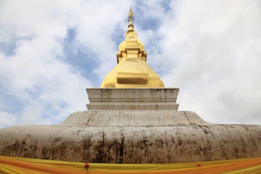 Phra That Kham Kean Pagoda Chedi over blue sky
