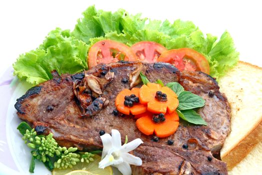 T Bone Pepper Steak with vegetable isolated on white