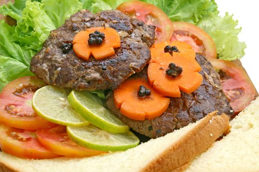 Closeup of Grill Beef Hamburger with vegetable and bread.