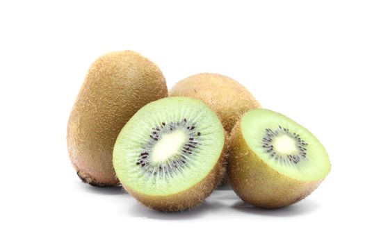 half and whole Kiwi fruit on white background