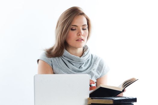 Portrait of a young and beautiful girl student who is preparing for exams
