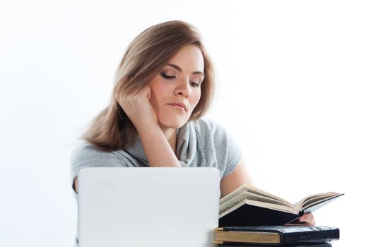 Portrait of a young and beautiful girl student who is preparing for exams