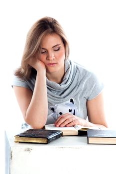 Portrait of a young and beautiful girl student who is preparing for exams