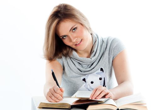 Portrait of a young and beautiful girl student who is preparing for exams
