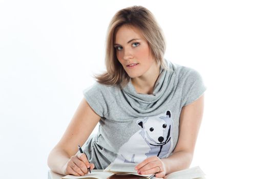 Portrait of a young and beautiful girl student who is preparing for exams