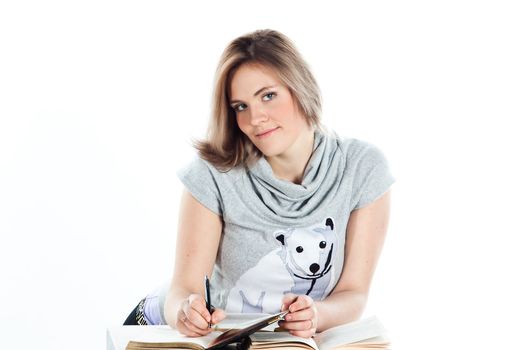 Portrait of a young and beautiful girl student who is preparing for exams