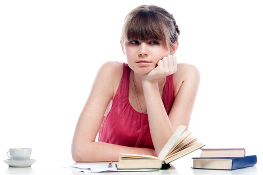 Portrait of a young and beautiful girl student who is preparing for exams