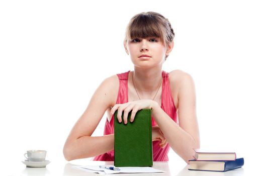 Portrait of a young and beautiful girl student who is preparing for exams