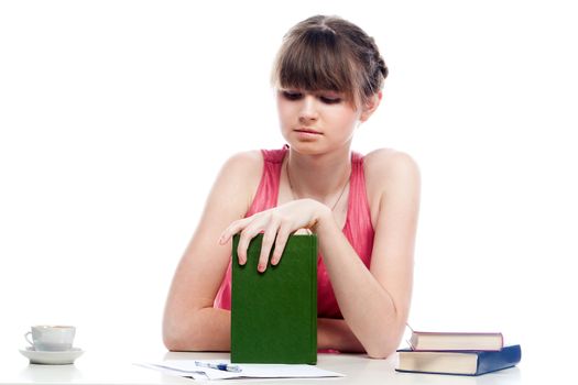 Portrait of a young and beautiful girl student who is preparing for exams