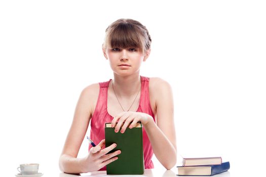 Portrait of a young and beautiful girl student who is preparing for exams