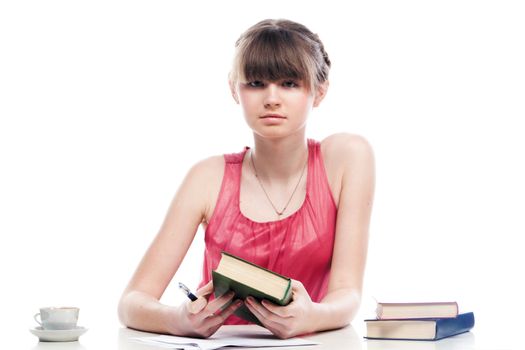Portrait of a young and beautiful girl student who is preparing for exams