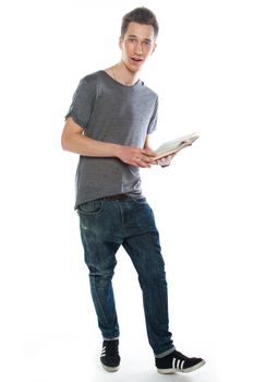 Portrait of a young attractive guy who is preparing for the exams at a university or college