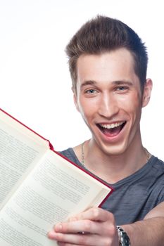 Portrait of a young attractive guy who is preparing for the exams at a university or college