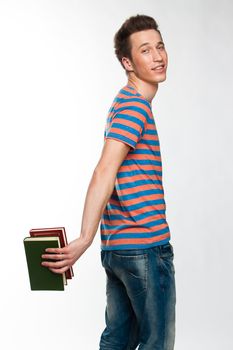 Portrait of a young attractive guy who is preparing for the exams at a university or college