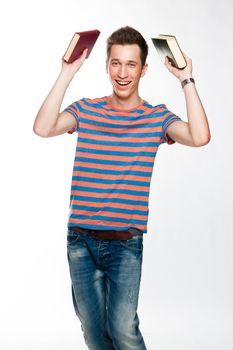 Portrait of a young attractive guy who is preparing for the exams at a university or college