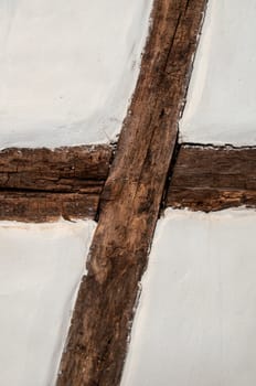 Old wooden framework facade of a half timbered house